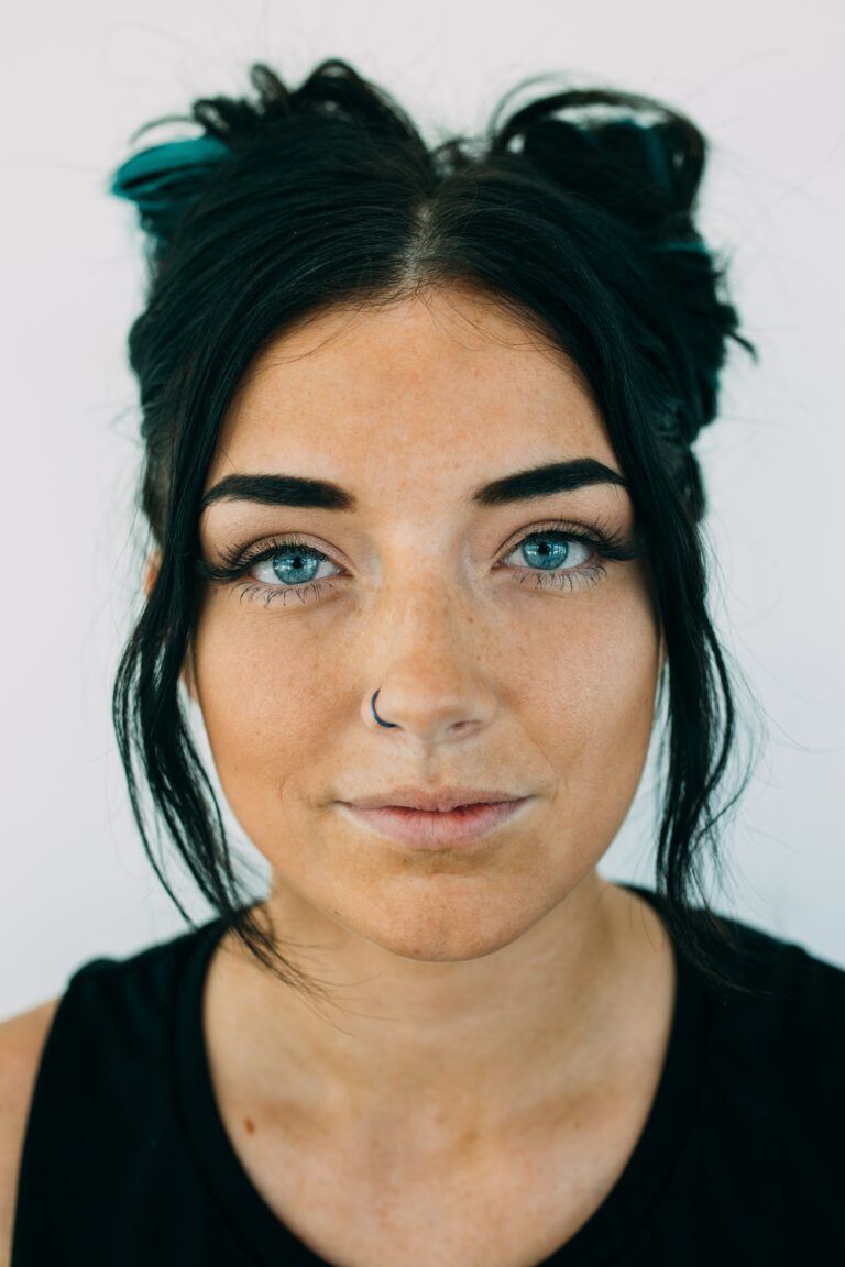 A woman with blue eyes and black hair.